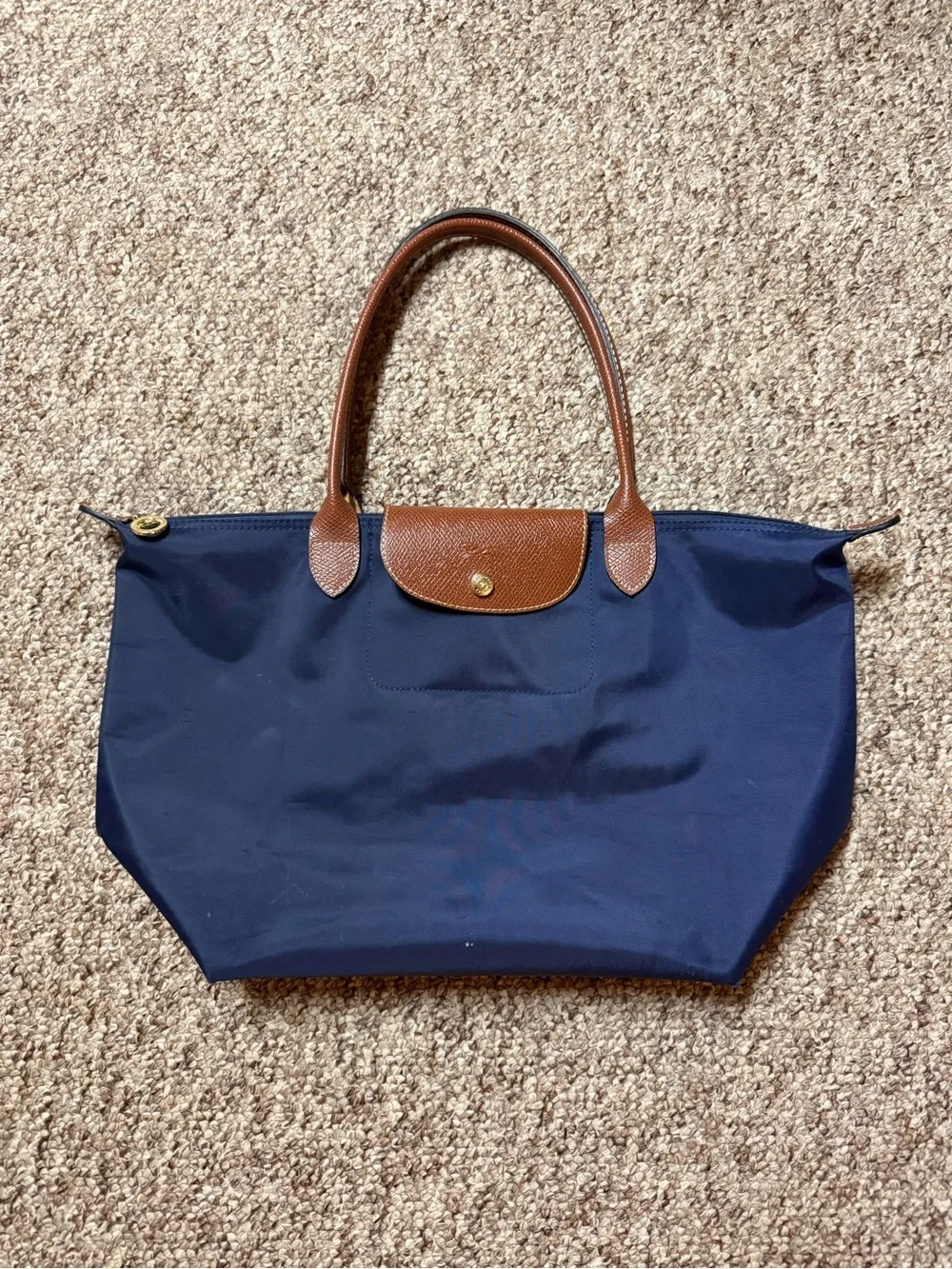 Longchamp Le Pliage Large Navy Tote with Brown Leather Trim.